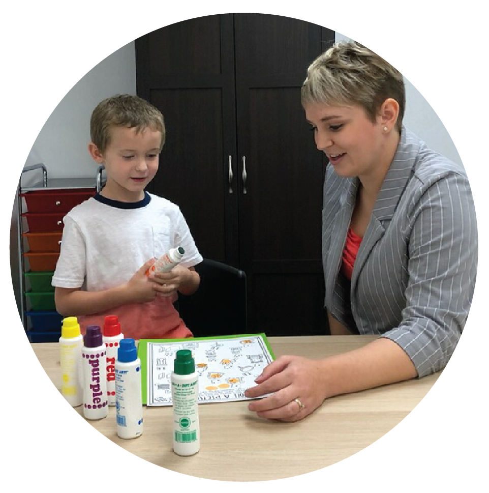 Jaimee working with a little boy on homework