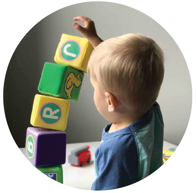 Pre-school child playing with blocks